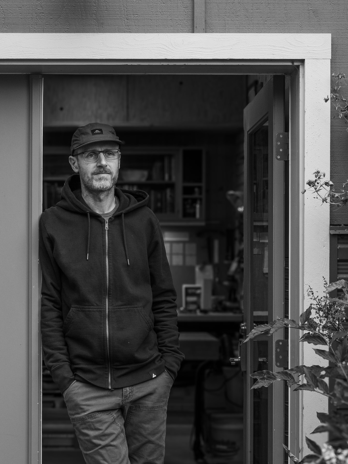 Laël Gordon standing in the doorway of his woodworking shop